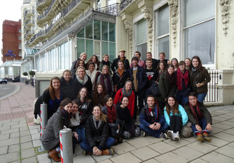 Group of students sitting on a London street