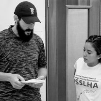 man reading from cards